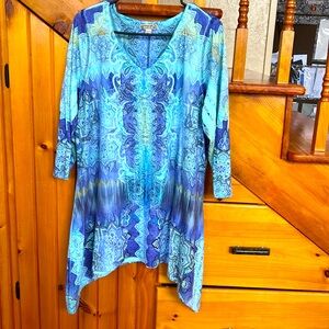 Three quarter sleeve tunic, embellished with in the front.